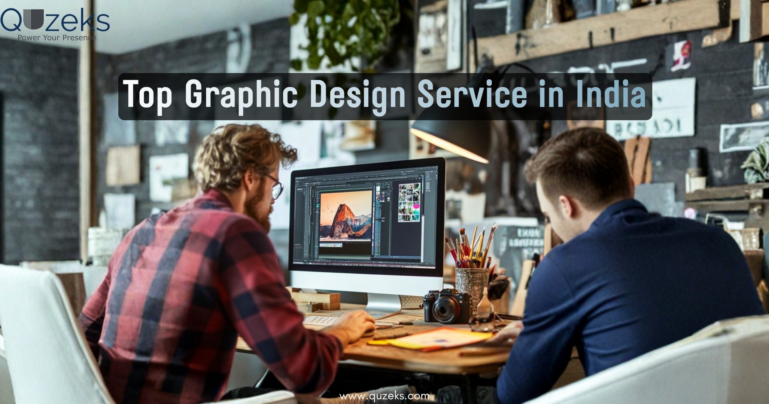 Two graphic designers working on a computer in a creative studio with design software open, representing top graphic design services in India by Quzeks.